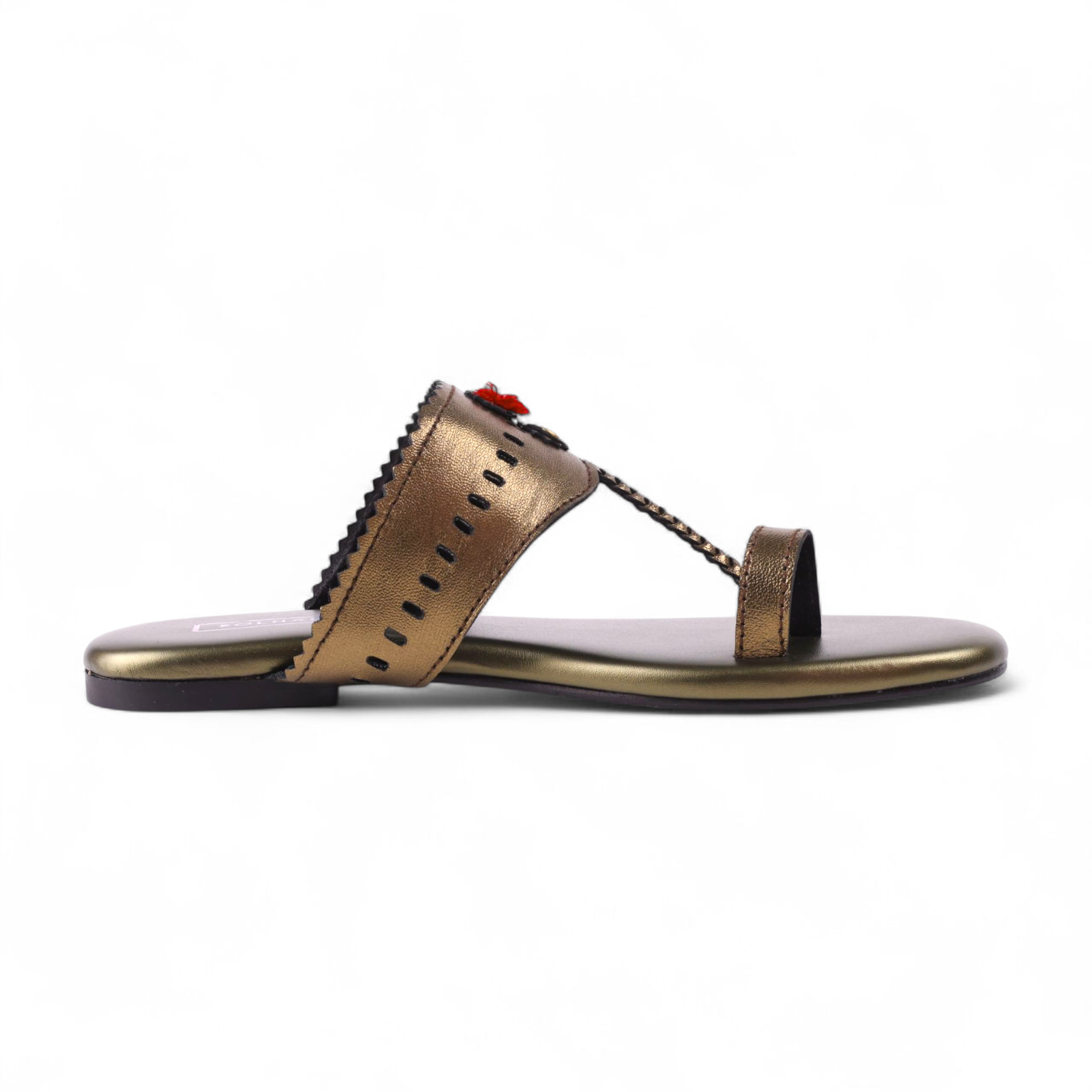 Bronze kolhapuri sandal with decorative elements on a white background