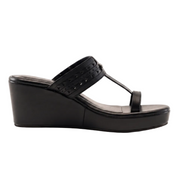 A single black wedge sandal with a T-strap and perforated upper band, shown from a side profile on a white background.