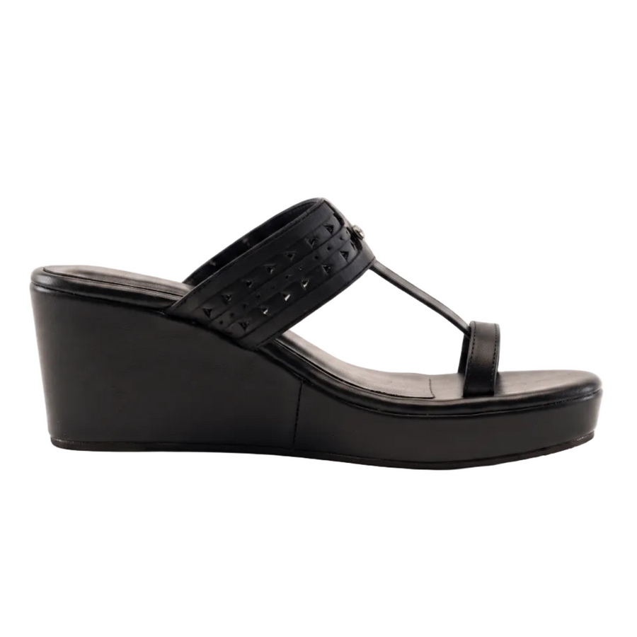 A single black wedge sandal with a T-strap and perforated upper band, shown from a side profile on a white background.