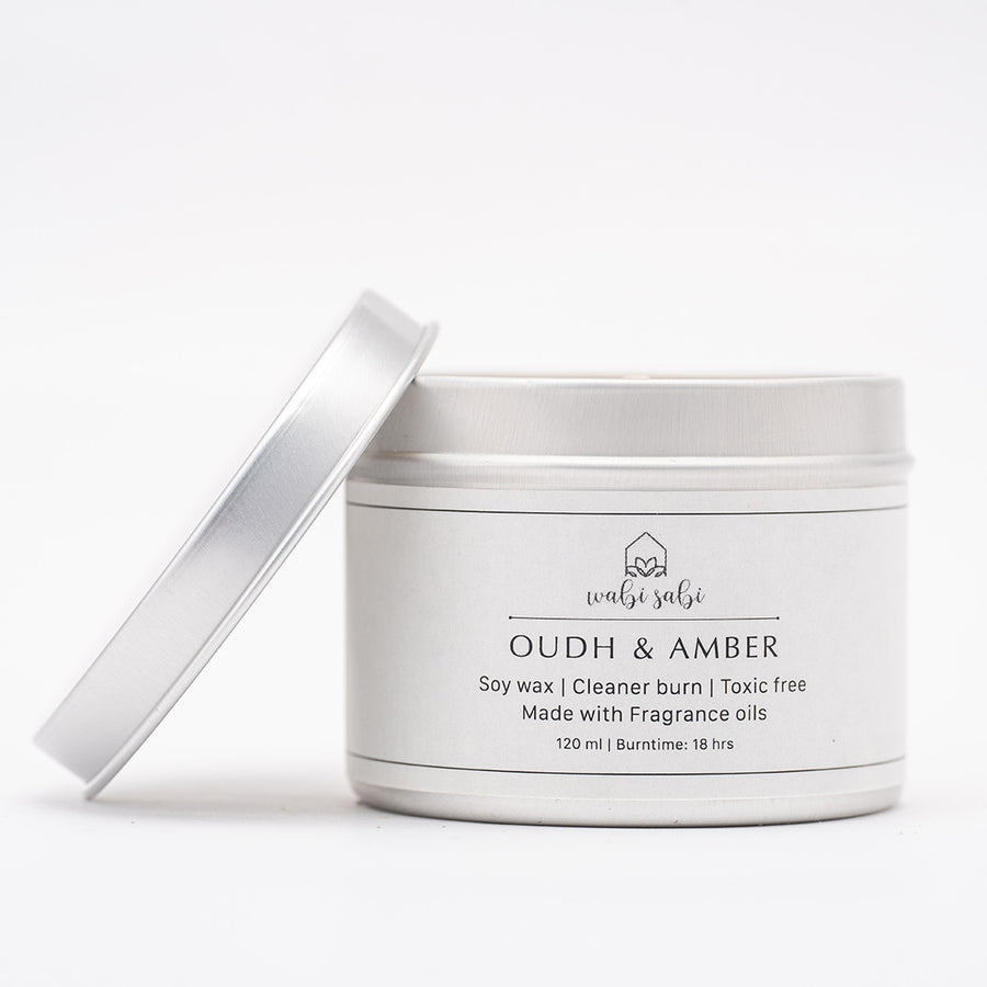 Silver candle jar with lid on a white background