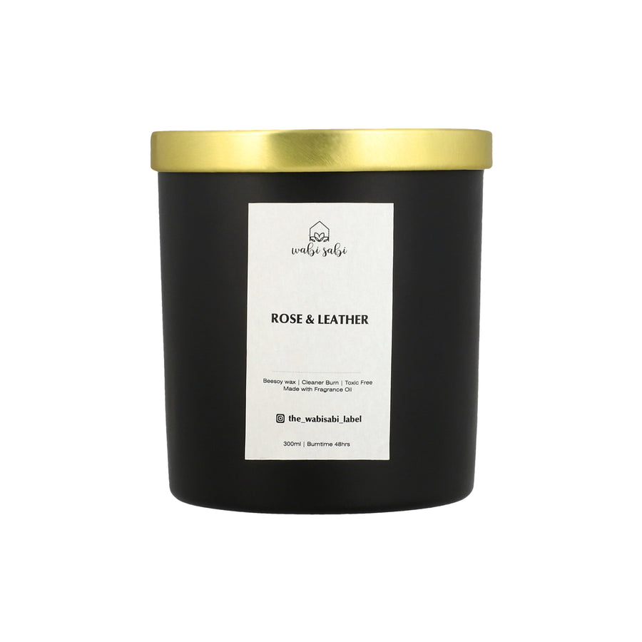 Black candle with gold lid. rose and leather candle